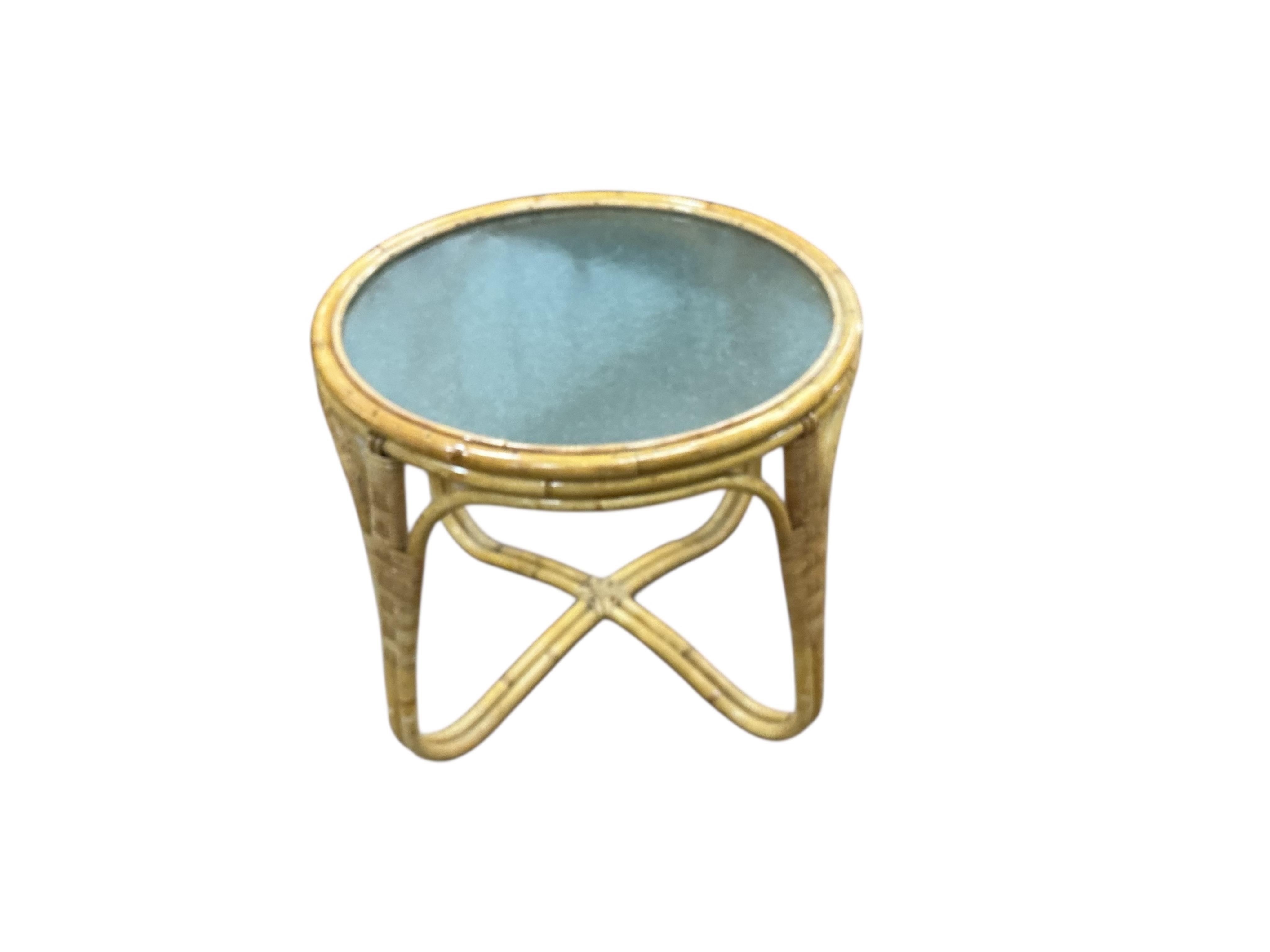 A mid century Angrave’s of Leicester “Invincible” bamboo suite comprising a pair of chairs, one brass mounted and reclining, a pair of matching footstools and a circular glass top occasional table, all with recently reup